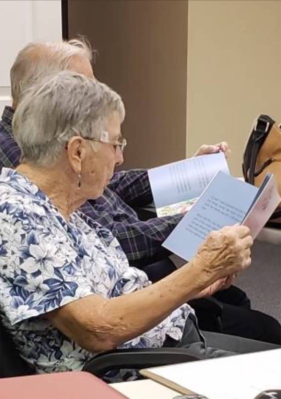 Special to the Pahrump Valley Times CASA advocates are seen reading the new books donated by th ...