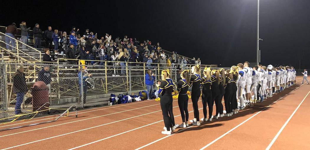 Tom Rysinski/Pahrump Valley Times Moapa Valley fans, cheerleaders and players join in singing t ...