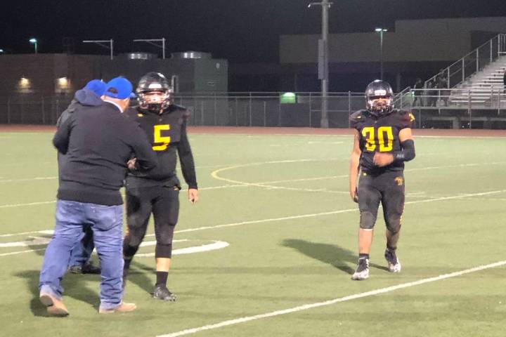 Tom Rysinski/Pahrump Valley Times Pahrump Valley senior Kody Peugh (5) and junior Fabian Sorian ...