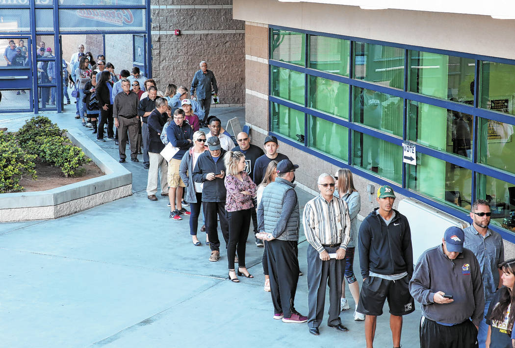 Voters lined up to cast their vote at a polling station at Coronado High School on Tuesday, Nov ...
