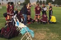 Tom Rysinski/Pahrump Valley Times Pahrump Valley High School girls soccer players gather around ...