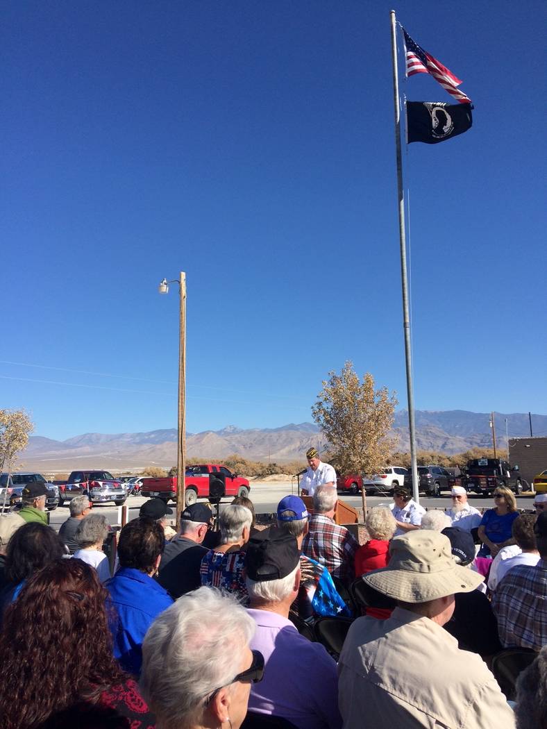 Robin Hebrock/Pahrump Valley Times The American flag and POW/MIA flag fly over the audience at ...