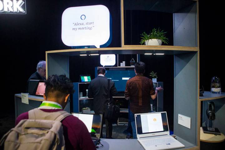 Attendees explore a room showcasing products integrated with Amazon's Alexa at the Sands Expo a ...