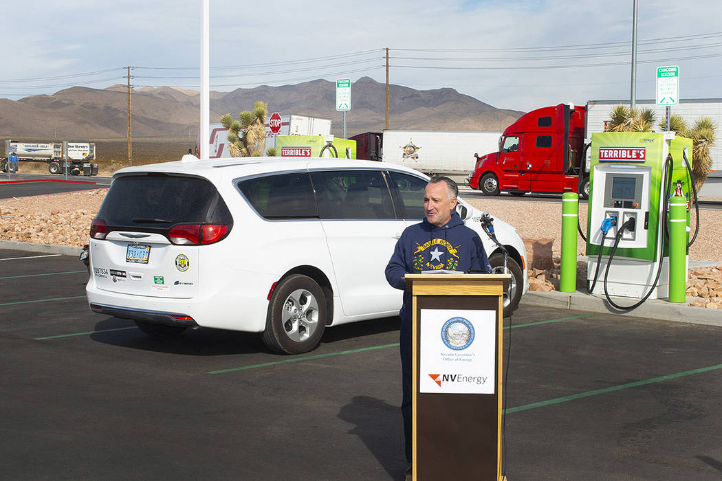 Assemblyman Chris Brooks gives remarks ahead of two DC fast electric vehicle chargers going liv ...