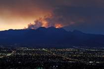 Smoke rises from the Carpenter 1 wildfire as the sun sets over Las Vegas on July 9, 2013. (Davi ...