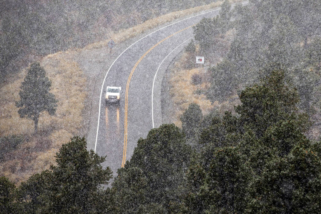 Snow falls along state Route 157 on Mount Charleston on Wednesday, Nov. 20, 2019. (L.E. Baskow/ ...