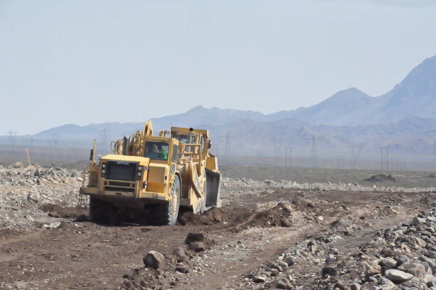 GridLiance/Special to the Pahrump Valley Times Construction crews work at a project to raise th ...