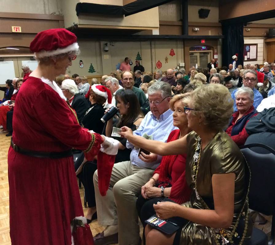 Robin Hebrock/Pahrump Valley Times This file photo shows Pam Raneri, dressed as Mrs. Claus, hel ...