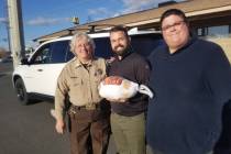 David Jacobs/Pahrump Valley Times Sheriff Sharon Wehrly (left), assisted by community member R ...