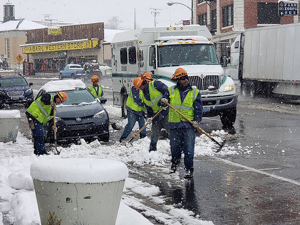 Nancy Whipperman/Pahrump Valley Times Crews remove snow in Tonopah on Nov. 21 as a storm moved ...