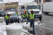 Nancy Whipperman/Pahrump Valley Times Crews remove snow in Tonopah on Nov. 21 as a storm moved ...