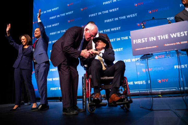 Democratic presidential candidate Sen. Bernie Sanders, I-Vt., center left, greets U.S. Sen. Har ...