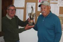 Special to the Pahrump Valley Times Tournament director Ed Plavac, left, presents Lorenzo Alvar ...