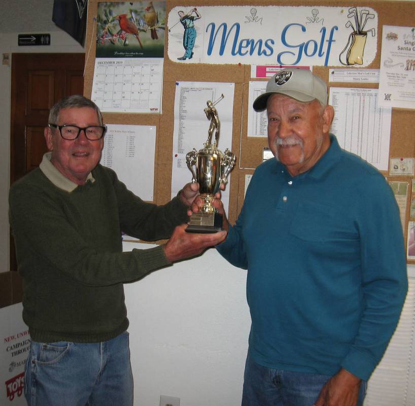 Special to the Pahrump Valley Times Tournament director Ed Plavac, left, presents Lorenzo Alvar ...
