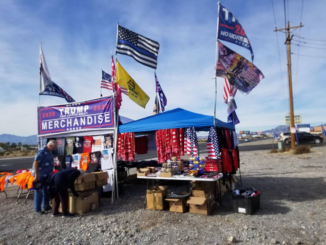 David Jacobs/Pahrump Valley Times A couple visits the traveling Donald Trump merchandise store ...