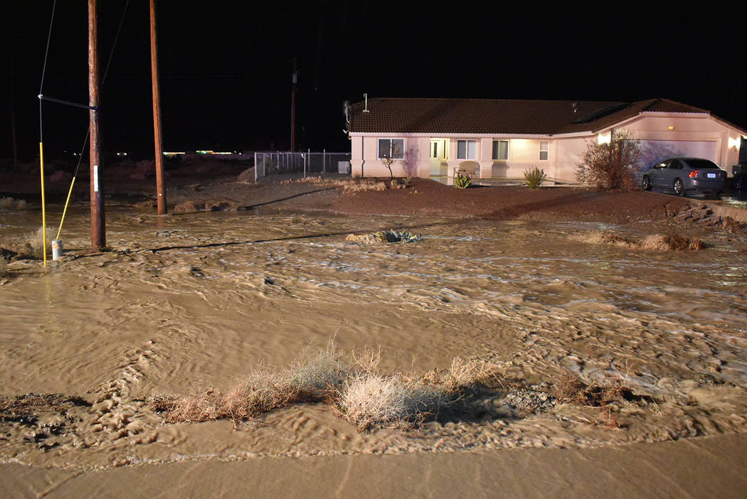 Special to the Pahrump Valley Times Heavy rains on Sunday night Dec. 8, caused major flooding i ...