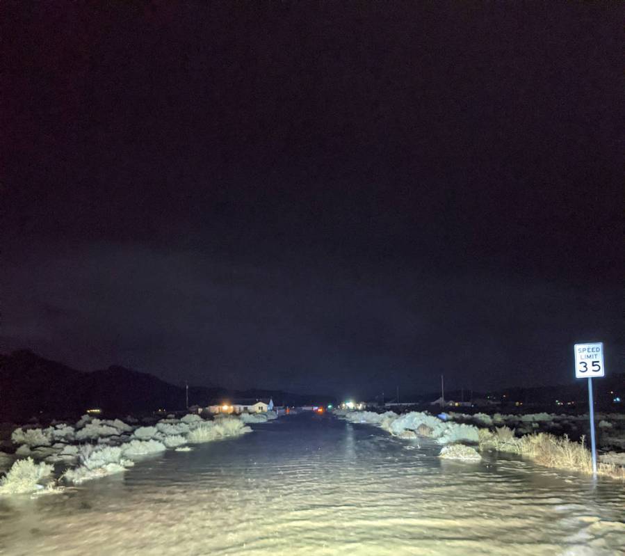 Charlotte Uyeno/Pahrump Valley Times Flooded streets created serious driving hazards for reside ...