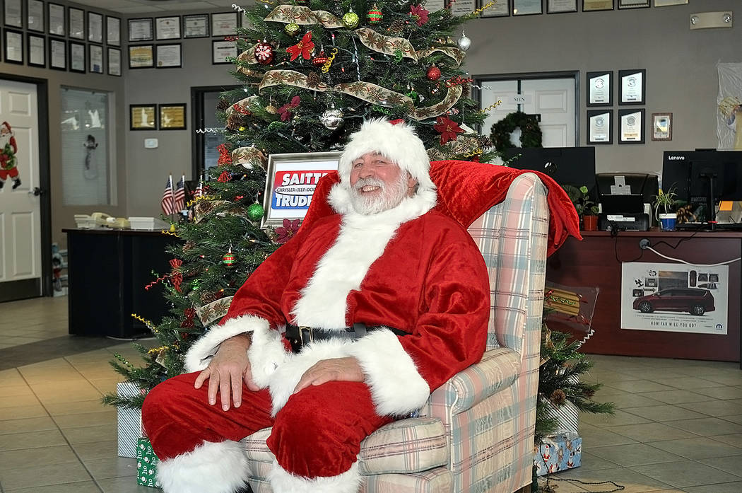 Horace Langford Jr./Pahrump Valley Times Santa visits the Saitta Trudeau car dealership on as ...