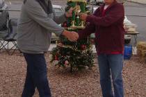 Mike Norton/Special to the Pahrump Valley Times Dennis Andersen, left, hands the first-place tr ...