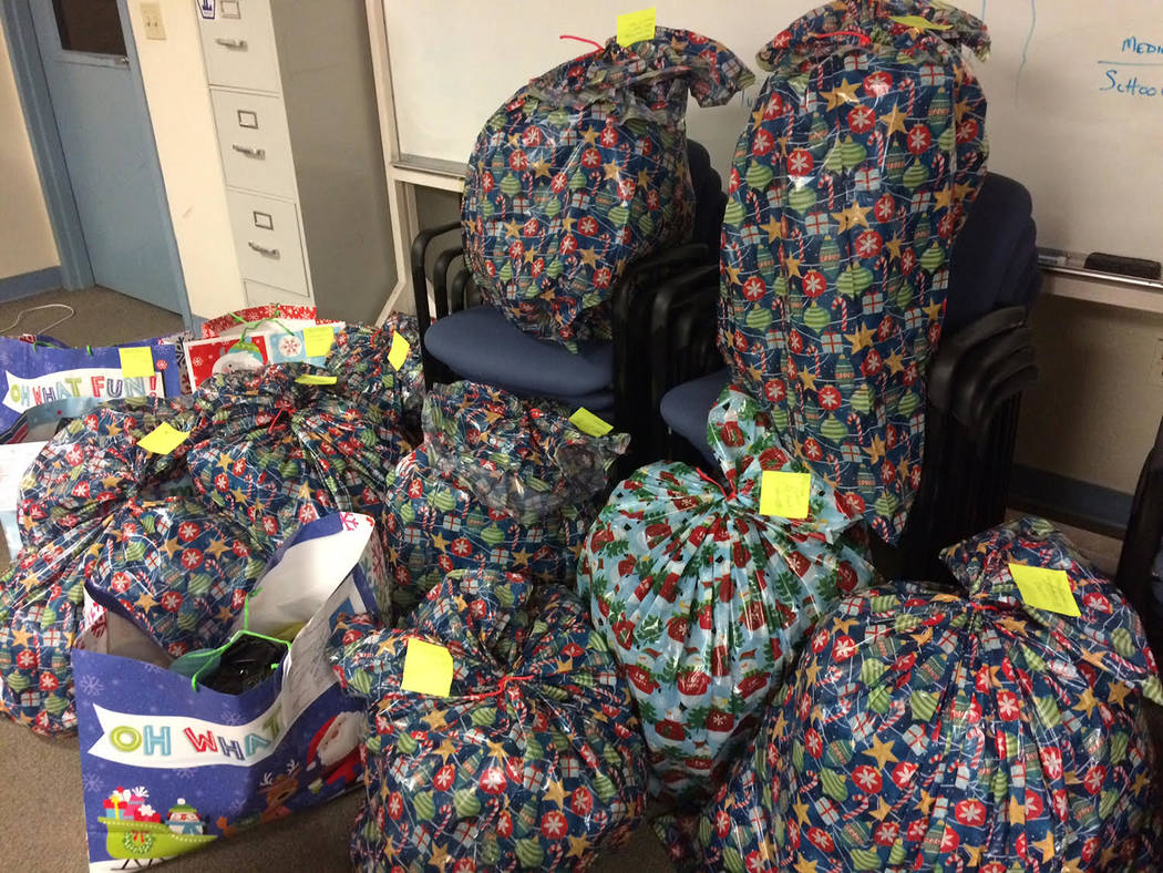 Robin Hebrock/Pahrump Valley Times Stacks of presents were place into Christmas bags and marked ...
