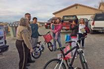 Robin Hebrock/Pahrump Valley Times Beaming with delight, a local family is seen thanking first ...