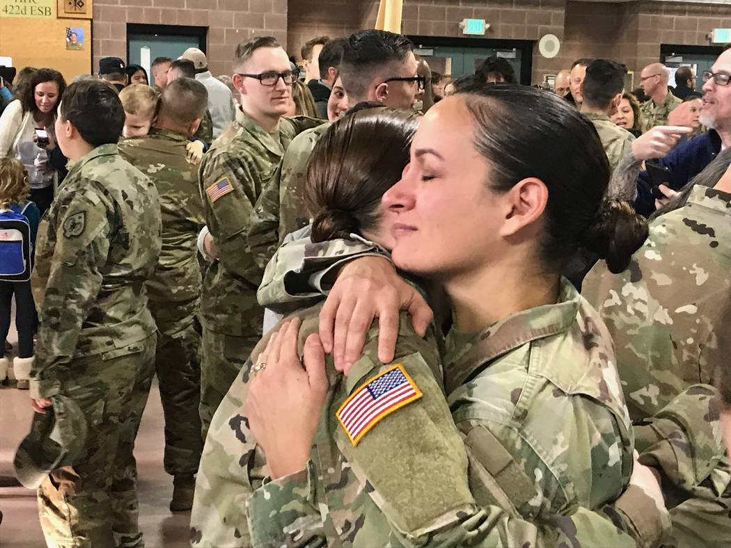 Sgt. 1st Class Luciana Irenze (right) hugs Sgt. Alison Martindale following the mobilization ce ...