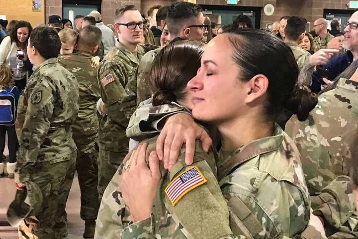 Sgt. 1st Class Luciana Irenze (right) hugs Sgt. Alison Martindale following the mobilization ce ...