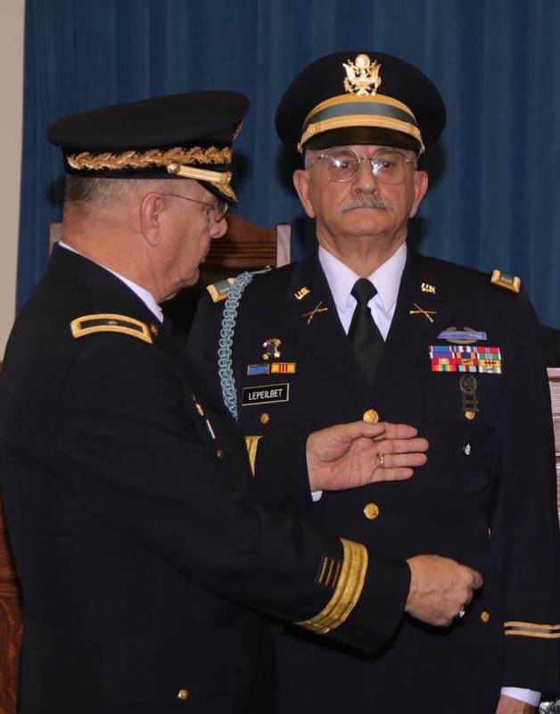 Steve Ranson/Nevada News Group Retired Brig. Gen. Michael LePeilbet, left, prepares to pin the ...