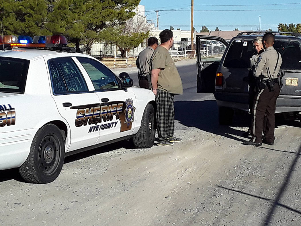 Selwyn Harris/Pahrump Valley Times A Nye County Sheriff's Office Sgt. along with deputies quest ...