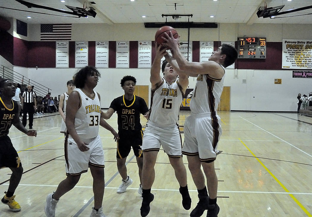 Horace Langford Jr./Pahrump Valley Times Dylan Severt (15) and Andrew Avena (1) batete each oth ...