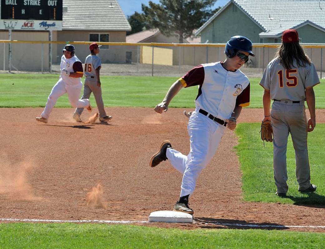 Horace Langford Jr./Pahrump Valley Times Chase McDaniel rounds third base and heads for home fo ...