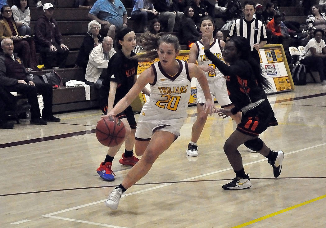 Horace Langford Jr./Pahrump Valley Times Maddy Souza drives against the Mojave defense during P ...