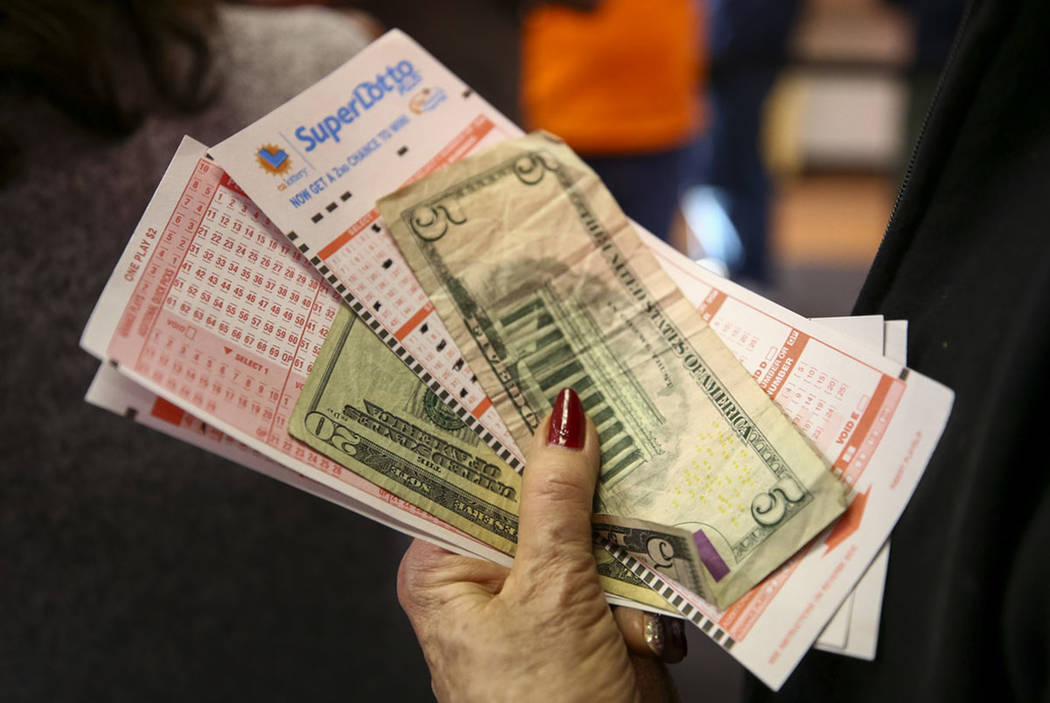 A woman waits to buy lottery tickets at The Lotto Store at Primm just inside the California bor ...