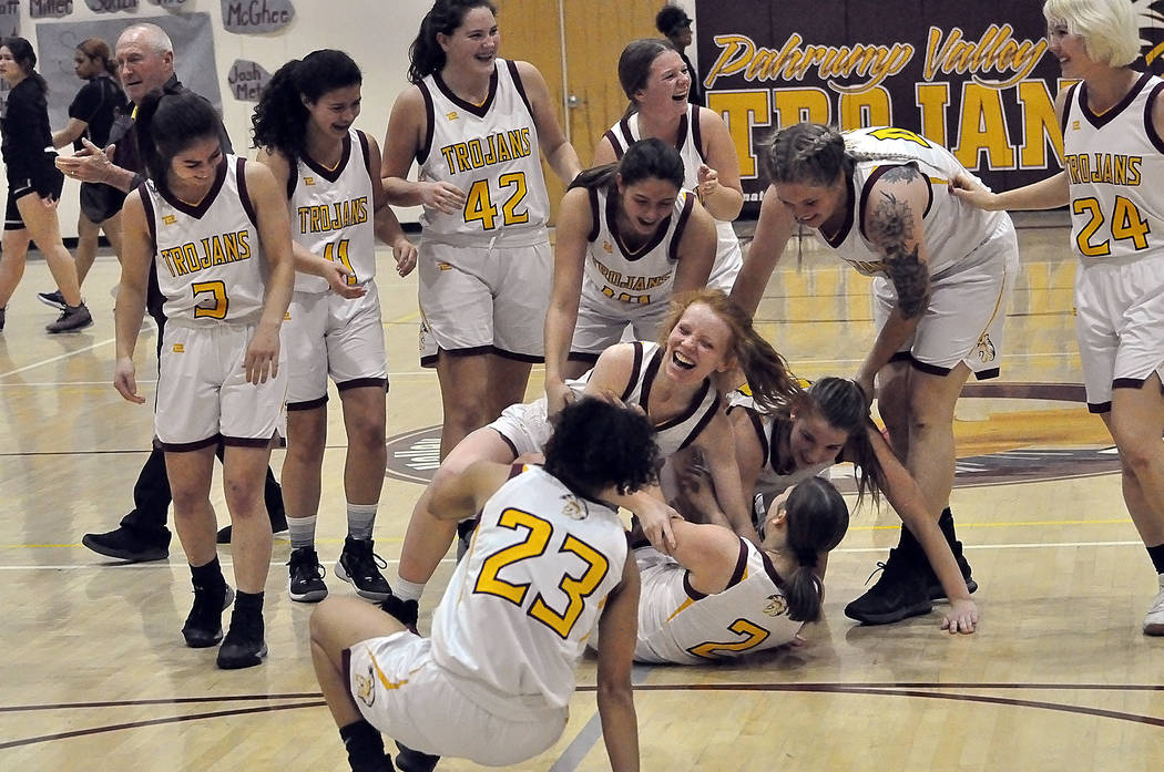 Horace Langford Jr./Pahrump Valley Times Sophomore Tayla Wombaker (2) gets mobbed by Pahrump Va ...