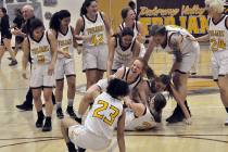 Horace Langford Jr./Pahrump Valley Times Sophomore Tayla Wombaker (2) gets mobbed by Pahrump Va ...