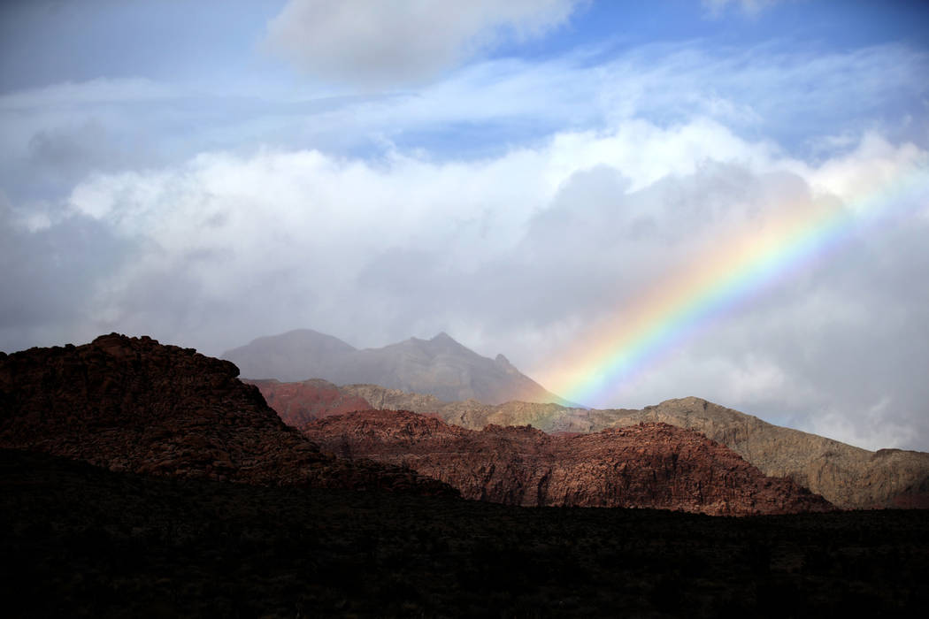 Clouds and a rainbow in Red Rock Canyon National Conservation Area near Las Vegas, Thursday, Ja ...