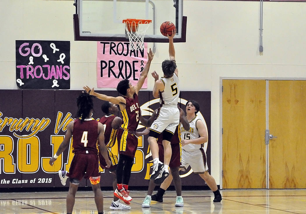 Horace Langford Jr./Pahrump Valley Times Junior Logan Gavenda drives for 2 of his 16 points Tue ...