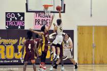 Horace Langford Jr./Pahrump Valley Times Junior Logan Gavenda drives for 2 of his 16 points Tue ...