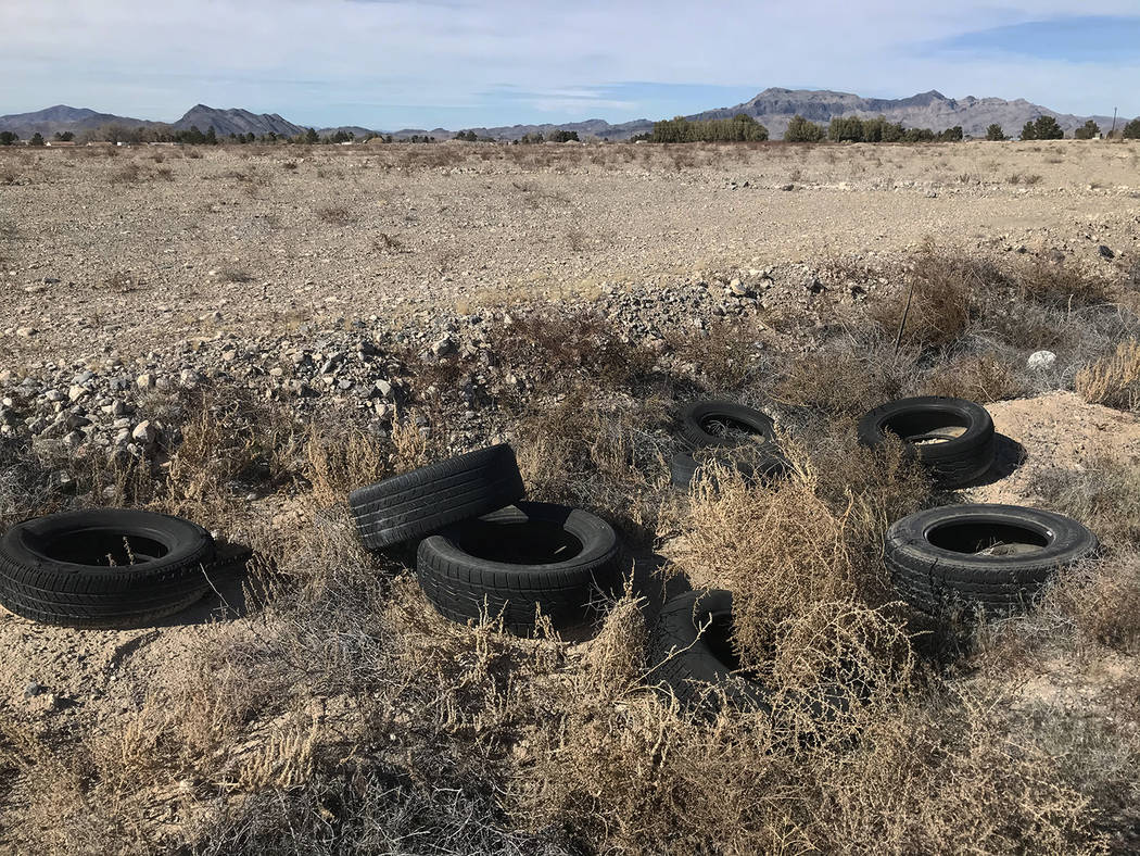 Robin Hebrock/Pahrump Valley Times A pile of discarded tires on the side of one of the few pave ...