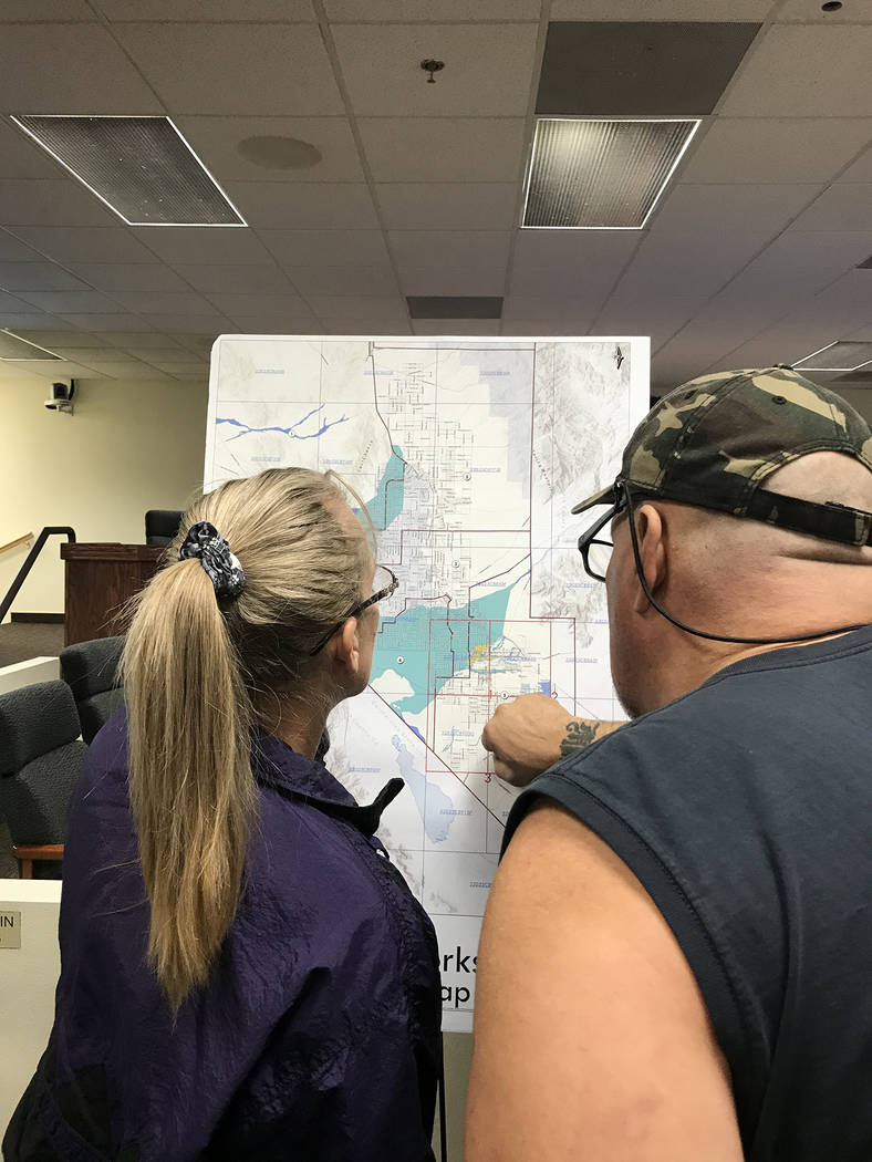 Robin Hebrock/Pahrump Valley Times Two Pahrump residents are pictured observing one of the maps ...