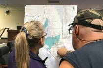 Robin Hebrock/Pahrump Valley Times Two Pahrump residents are pictured observing one of the maps ...