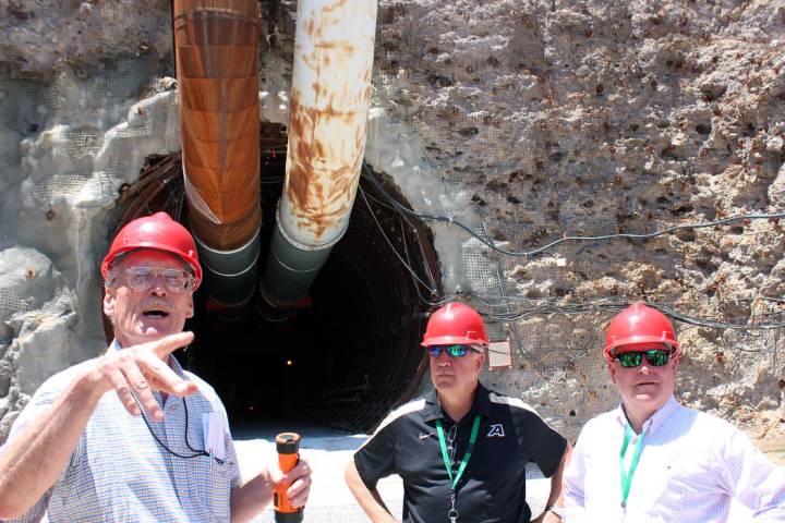 Jeffrey Meehan/Pahrump Valley Times William Boyle, U.S. Department of Energy geologist (left), ...