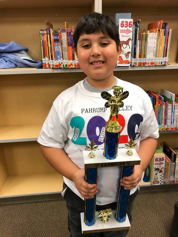 Robin Hebrock/Pahrump Valley Times A very proud Orion Deverse, a second grade student at J.G. J ...