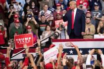President Donald Trump gestures to supporters during a campaign rally, Monday, Feb. 10, 2020, i ...