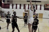 Horace Langford Jr./Pahrump Valley Times Junior Kate Daffer goes up for 2 of her game-high 24 p ...