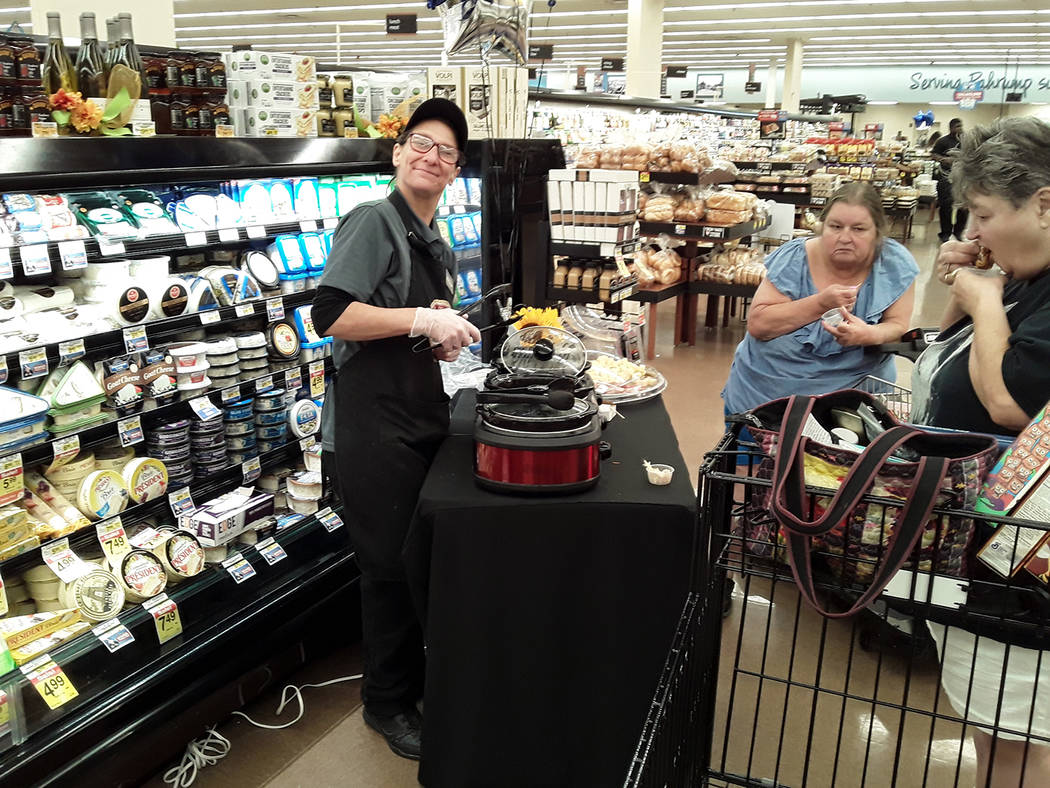 Selwyn Harris/Pahrump Valley Times Shoppers were treated to samples from the new hot food bar. ...