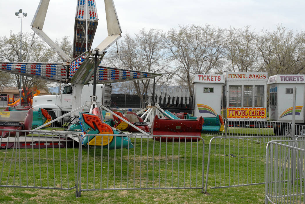 Horace Langford Jr. / Pahrump Valley Times - Davis Amusement carnival rides are trucked into pl ...