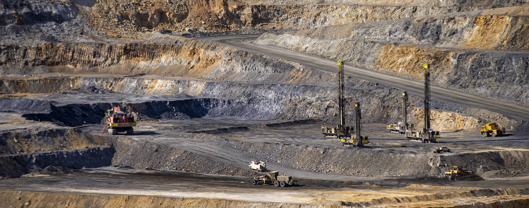 Workers make progress in open pit drilling in preparation to blast at Nevada Gold Mines' Carlin ...