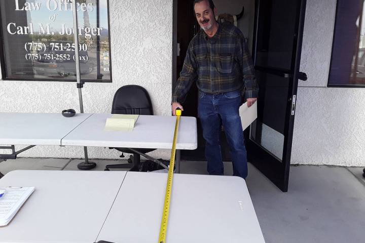 Selwyn Harris/Pahrump Valley Times Attorney Carl M. Joerger literally is taking social distanci ...