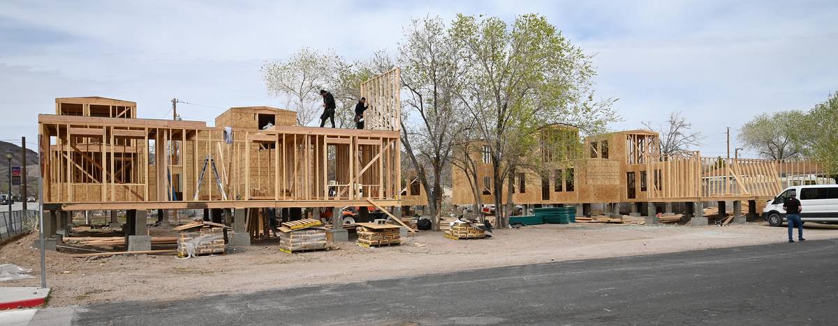 Richard Stephens/Special to the Pahrump Valley Times Construction crews work on a cluster of ti ...